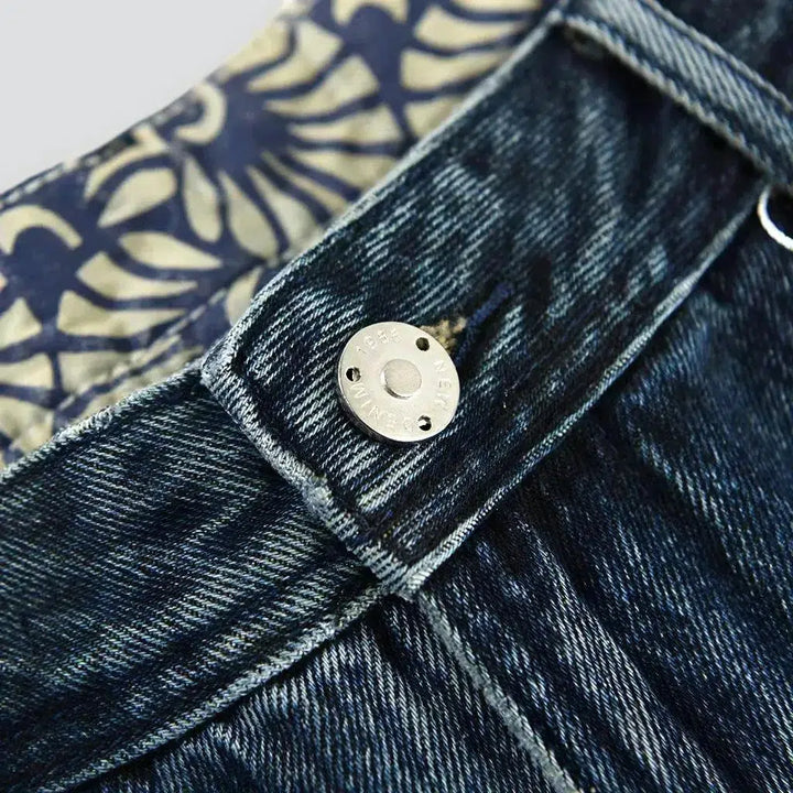 Medium-wash men's mid-waist jeans