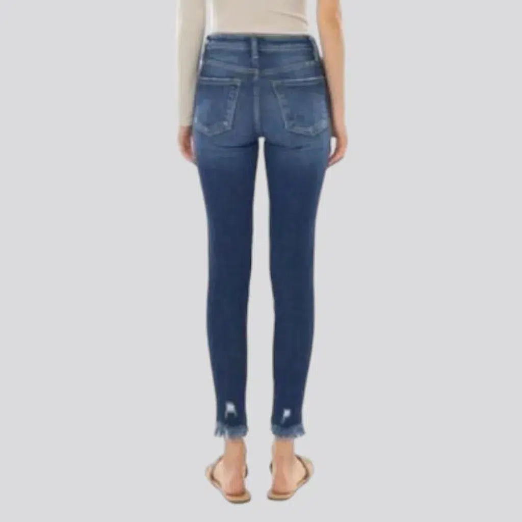 Medium-wash skinny jeans
 for ladies